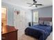 Bedroom with carpet, blue walls, and double-door closet with mini basketball hoop at 300 Bordeaux Ln, Cary, NC 27511