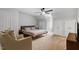 Bright bedroom featuring a ceiling fan, a comfortable bed, and neutral carpet at 300 Bordeaux Ln, Cary, NC 27511