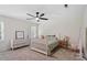 Inviting bedroom featuring natural light, a ceiling fan, and comfortable furnishings at 300 Bordeaux Ln, Cary, NC 27511