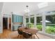 Charming breakfast nook bathed in natural light with a view of the landscaped backyard at 300 Bordeaux Ln, Cary, NC 27511