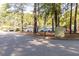 Sign listing various community amenities and directions, including the pool and tennis courts at 300 Bordeaux Ln, Cary, NC 27511