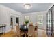 Formal dining room with chandelier, large windows, and a sophisticated ambiance at 300 Bordeaux Ln, Cary, NC 27511