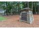 Stone sign marking the entrance to MacGregor Downs Country Club at 300 Bordeaux Ln, Cary, NC 27511