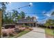 Beautiful building with a covered porch and landscape, perfect for outdoor events at 300 Bordeaux Ln, Cary, NC 27511