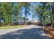 Sprawling home featuring a long driveway lined with trees at 300 Bordeaux Ln, Cary, NC 27511
