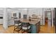 Bright kitchen features a large island with seating, custom cabinets, and modern stainless steel appliances at 300 Bordeaux Ln, Cary, NC 27511