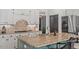 Gourmet kitchen featuring a granite island, stainless appliances, and a tiled backsplash at 300 Bordeaux Ln, Cary, NC 27511