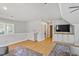 Second-story living room with hardwood floors and recessed lighting at 300 Bordeaux Ln, Cary, NC 27511