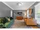 Bright living room with hardwood floors, two sofas, area rug and decorative lamps at 300 Bordeaux Ln, Cary, NC 27511