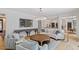 Spacious living room showcasing hardwood floors, an oversized TV, and comfortable seating at 300 Bordeaux Ln, Cary, NC 27511
