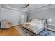 Spacious main bedroom with tray ceiling, hardwood floors and ensuite bathroom access at 300 Bordeaux Ln, Cary, NC 27511
