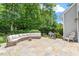 Backyard patio features lounge seating and a grill, perfect for outdoor entertaining at 300 Bordeaux Ln, Cary, NC 27511