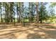 Lakeside playground area with mature trees offering shade and multiple kayaks ready for a day on the lake at 300 Bordeaux Ln, Cary, NC 27511