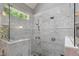 Gorgeous bathroom with a walk-in shower, rain shower head and mosaic tile accent at 300 Bordeaux Ln, Cary, NC 27511