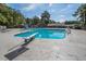 Bright community swimming pool area with diving board, slides and lounging chairs at 300 Bordeaux Ln, Cary, NC 27511