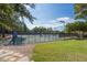 Exterior view of the fenced-in community tennis courts and well-manicured lawn area at 300 Bordeaux Ln, Cary, NC 27511