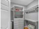 Well-organized walk-in closet with custom shelving and ample storage space at 300 Bordeaux Ln, Cary, NC 27511