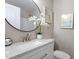 Bathroom featuring modern finishes with vanity and accent wall decor at 3325 Old Buffaloe Rd, Raleigh, NC 27604