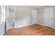 Bedroom features hardwood floors and en-suite bathroom at 3325 Old Buffaloe Rd, Raleigh, NC 27604