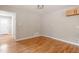 Bright bedroom features hardwood floors, fresh paint and cabinet storage at 3325 Old Buffaloe Rd, Raleigh, NC 27604