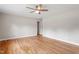 Bright living room with hardwood floors, a ceiling fan, and neutral paint at 3325 Old Buffaloe Rd, Raleigh, NC 27604