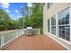 Spacious backyard deck, perfect for grilling, with white railings and lush green backyard at 4 Pickard Pl, Durham, NC 27703