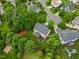 Aerial view of backyard with patio, deck, hot tub, beautiful landscaping, and mature trees at 4 Pickard Pl, Durham, NC 27703