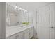 Bathroom with a white vanity, large mirror, and shower-tub combo at 4 Pickard Pl, Durham, NC 27703