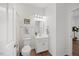Cozy bathroom features tile floors, a single sink vanity and shower with curtain at 4 Pickard Pl, Durham, NC 27703