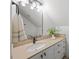 Bathroom with vanity, neutral countertops and a large framed mirror at 4 Pickard Pl, Durham, NC 27703
