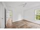 Bright, airy bedroom with luxury vinyl floors, ceiling fan and a window providing natural light at 4 Pickard Pl, Durham, NC 27703