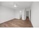 Bright, airy bedroom with luxury vinyl floors and doorway access to a closet and bathroom at 4 Pickard Pl, Durham, NC 27703