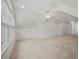 Finished bonus room with neutral carpet, bright windows, and white ceilings at 4 Pickard Pl, Durham, NC 27703