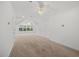 Bright bonus room with neutral carpet, many windows, and ceiling fans at 4 Pickard Pl, Durham, NC 27703