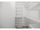 Walk-in closet featuring white shelving and ample storage space at 4 Pickard Pl, Durham, NC 27703