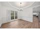 Dining room featuring hardwood floors, white crown molding and a window with bright light at 4 Pickard Pl, Durham, NC 27703