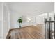 Bright foyer features an elegant staircase, chandelier and hardwood floors at 4 Pickard Pl, Durham, NC 27703