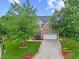 Beautiful brick home with manicured lawn, two-car garage, and inviting entryway at 4 Pickard Pl, Durham, NC 27703