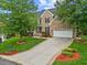 Beautiful brick home with manicured lawn, two-car garage, and inviting entryway at 4 Pickard Pl, Durham, NC 27703