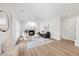 Living room boasts fireplace, large windows, hardwood floors and comfortable seating arrangement at 4 Pickard Pl, Durham, NC 27703