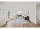 Light filled living room with fireplace, light hardwood floors, and neutral colored furniture at 4 Pickard Pl, Durham, NC 27703