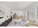 Spacious living room with hardwood floors, fireplace, lots of natural light, open to kitchen at 4 Pickard Pl, Durham, NC 27703