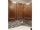The kitchen features tile backsplash and dark wood cabinets at 401 Commonwealth St, Durham, NC 27703