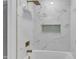 Modern bathroom features a tub with sleek shower head and modern tile surround at 460 Bunn Elementary School Rd, Bunn, NC 27508