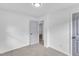 Neutral bedroom features soft carpet, a fresh coat of paint, and a gray paneled door at 460 Bunn Elementary School Rd, Bunn, NC 27508