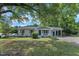 Charming, renovated single-story home with a blue front door, fresh paint, and a landscaped front yard at 460 Bunn Elementary School Rd, Bunn, NC 27508