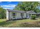 Inviting home exterior with fresh white paint, gray shutters, and a well-manicured lawn at 460 Bunn Elementary School Rd, Bunn, NC 27508