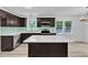 Modern kitchen features stainless appliances, an island, and ample counterspace at 460 Bunn Elementary School Rd, Bunn, NC 27508