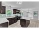 Stylish kitchen features stainless appliances, an island, and ample counterspace at 460 Bunn Elementary School Rd, Bunn, NC 27508
