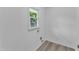 Laundry room with wood flooring, bright light, and electrical and water hookups at 460 Bunn Elementary School Rd, Bunn, NC 27508